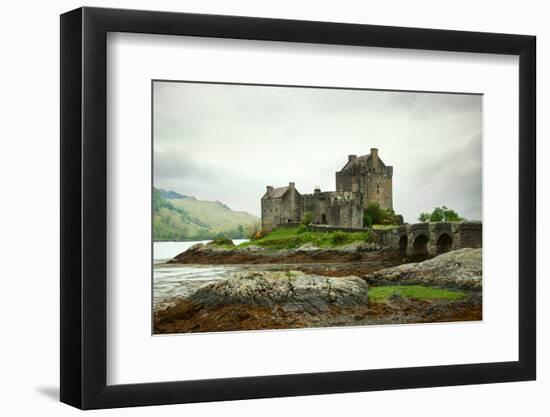 Eilean Donan Castle on a Cloudy Day. Low Tide. Highlands, Scotland. UK-A_nella-Framed Photographic Print