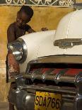 Young Boy Drumming on Old American Car's Bonnet,Trinidad, Sancti Spiritus Province, Cuba-Eitan Simanor-Photographic Print