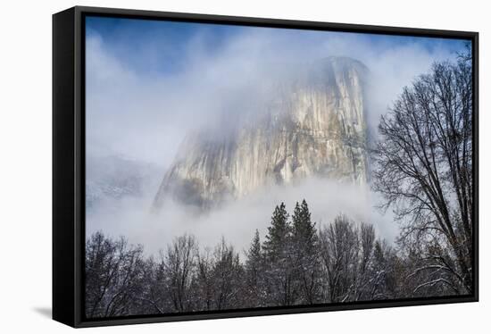 El Capitan Shrouded In Clouds And Framed By The Trees In The Meadow-Joe Azure-Framed Stretched Canvas