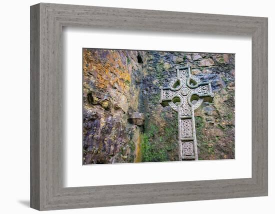Elaborate Celtic cross marks a grave at a historic Irish church, County Mayo, Ireland.-Betty Sederquist-Framed Photographic Print