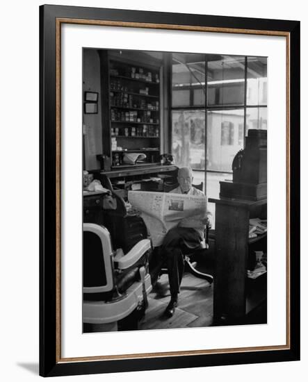 Elderly Barber Sitting Reading the Morning Paper in Small Village Shop in Small New England Town-Yale Joel-Framed Photographic Print