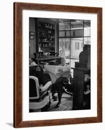 Elderly Barber Sitting Reading the Morning Paper in Small Village Shop in Small New England Town-Yale Joel-Framed Photographic Print