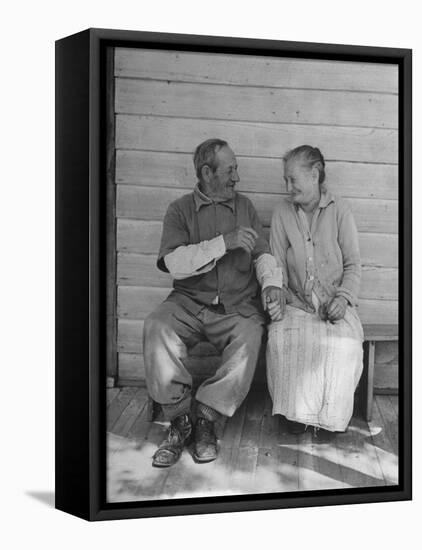 Elderly Couple Holding Hands-Peter Stackpole-Framed Premier Image Canvas