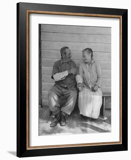 Elderly Couple Holding Hands-Peter Stackpole-Framed Photographic Print