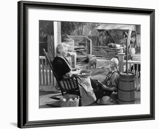 Elderly Couple on Porch of Farmhouse-null-Framed Photo