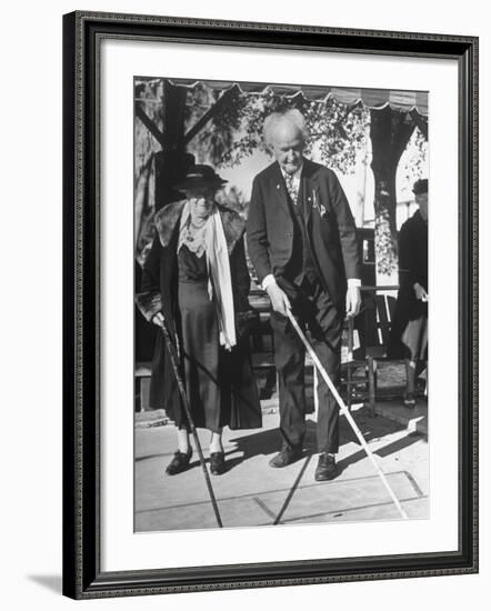 Elderly Couple Playing a Game of Shuffleboard on Outdoor Court at Hotel-Alfred Eisenstaedt-Framed Premium Photographic Print
