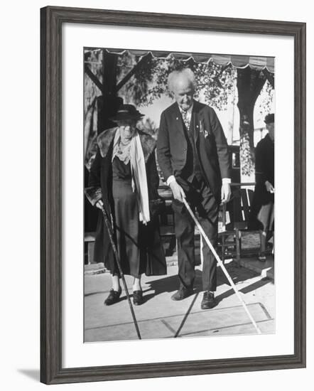 Elderly Couple Playing a Game of Shuffleboard on Outdoor Court at Hotel-Alfred Eisenstaedt-Framed Premium Photographic Print