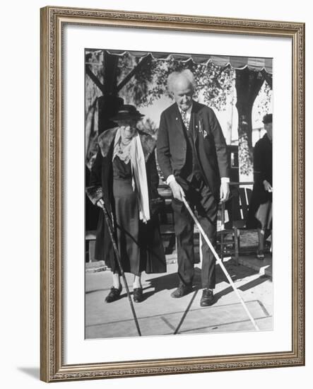 Elderly Couple Playing a Game of Shuffleboard on Outdoor Court at Hotel-Alfred Eisenstaedt-Framed Premium Photographic Print