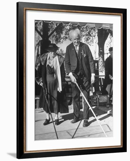 Elderly Couple Playing a Game of Shuffleboard on Outdoor Court at Hotel-Alfred Eisenstaedt-Framed Premium Photographic Print