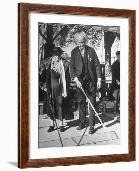 Elderly Couple Playing a Game of Shuffleboard on Outdoor Court at Hotel-Alfred Eisenstaedt-Framed Premium Photographic Print