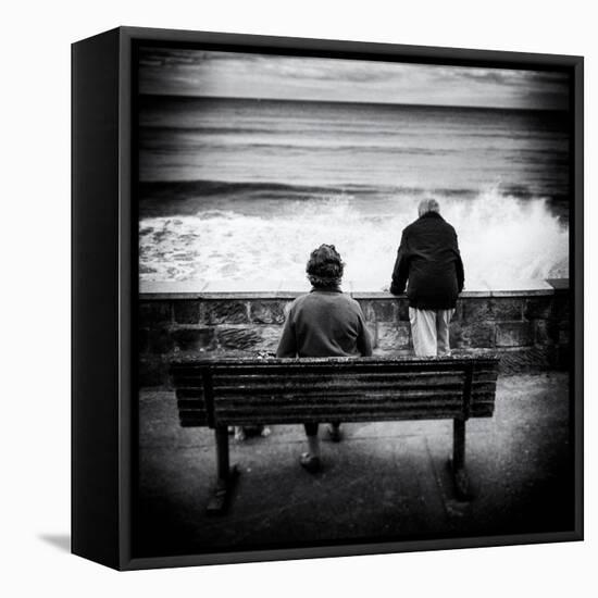 Elderly Couple Watch the Waves-Rory Garforth-Framed Premier Image Canvas