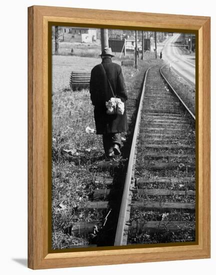 Elderly Hobo, with Bundle Strapped to His Back, Walking Along Train Tracks-Carl Mydans-Framed Premier Image Canvas