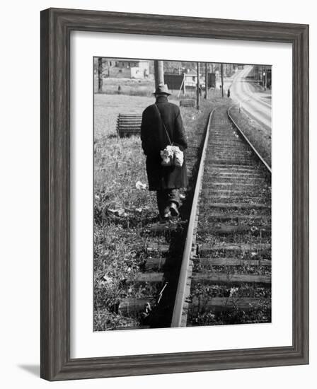 Elderly Hobo, with Bundle Strapped to His Back, Walking Along Train Tracks-Carl Mydans-Framed Photographic Print