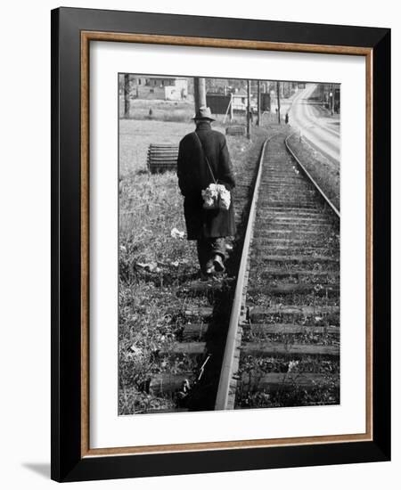 Elderly Hobo, with Bundle Strapped to His Back, Walking Along Train Tracks-Carl Mydans-Framed Photographic Print