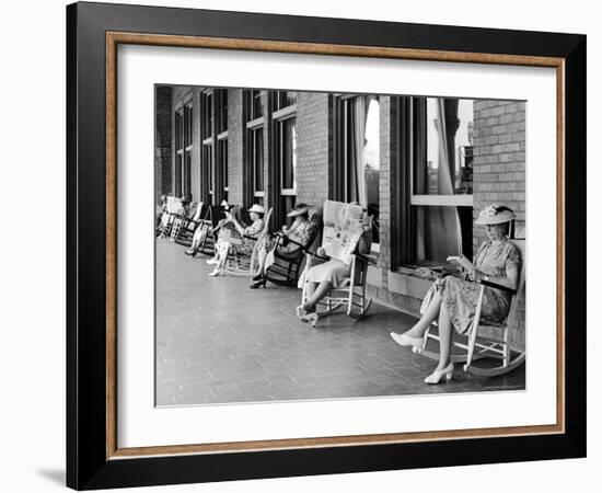 Elderly Ladies Reading Books and Newspapers While Rocking in Chairs on the Terrace of Dennis Hotel-Alfred Eisenstaedt-Framed Photographic Print