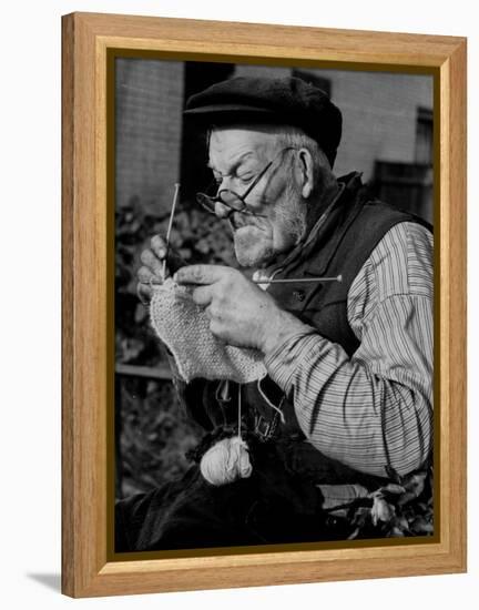 Elderly Man Knitting Garments During Drive to Provide Goods to Servicemen During the War-null-Framed Premier Image Canvas