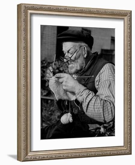 Elderly Man Knitting Garments During Drive to Provide Goods to Servicemen During the War-null-Framed Photographic Print