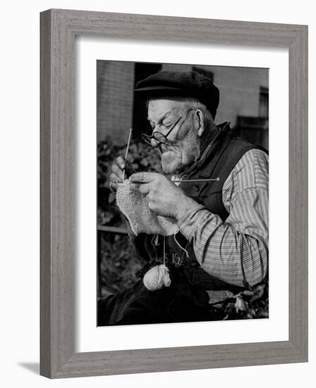 Elderly Man Knitting Garments During Drive to Provide Goods to Servicemen During the War-null-Framed Photographic Print