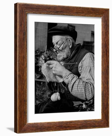 Elderly Man Knitting Garments During Drive to Provide Goods to Servicemen During the War-null-Framed Photographic Print