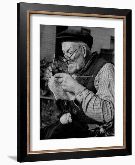 Elderly Man Knitting Garments During Drive to Provide Goods to Servicemen During the War-null-Framed Photographic Print