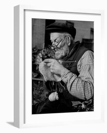 Elderly Man Knitting Garments During Drive to Provide Goods to Servicemen During the War-null-Framed Photographic Print