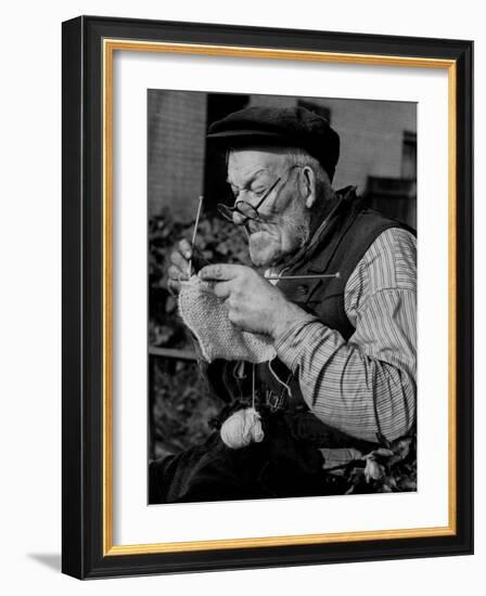 Elderly Man Knitting Garments During Drive to Provide Goods to Servicemen During the War-null-Framed Photographic Print