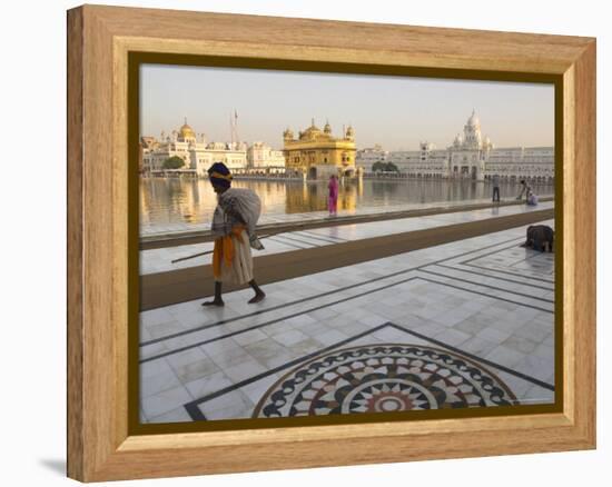 Elderly Sikh Pilgrim with Bundle and Stick Walking Around Holy Pool, Amritsar, India-Eitan Simanor-Framed Premier Image Canvas