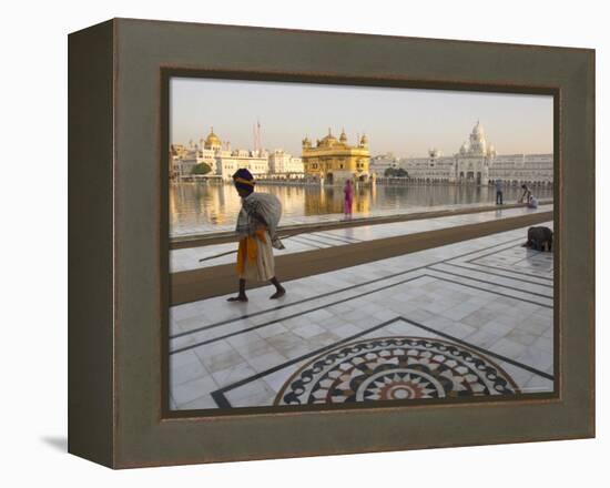 Elderly Sikh Pilgrim with Bundle and Stick Walking Around Holy Pool, Amritsar, India-Eitan Simanor-Framed Premier Image Canvas