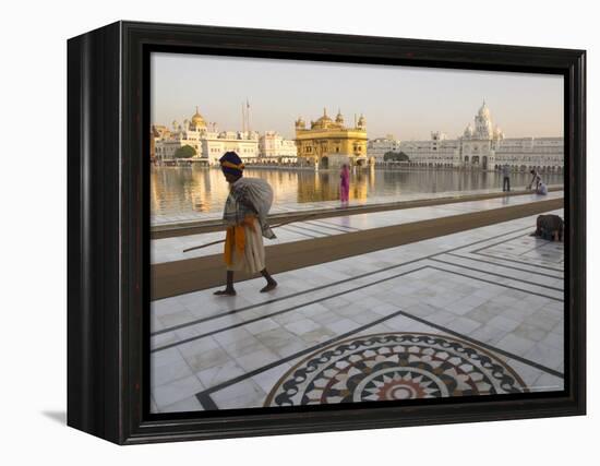 Elderly Sikh Pilgrim with Bundle and Stick Walking Around Holy Pool, Amritsar, India-Eitan Simanor-Framed Premier Image Canvas