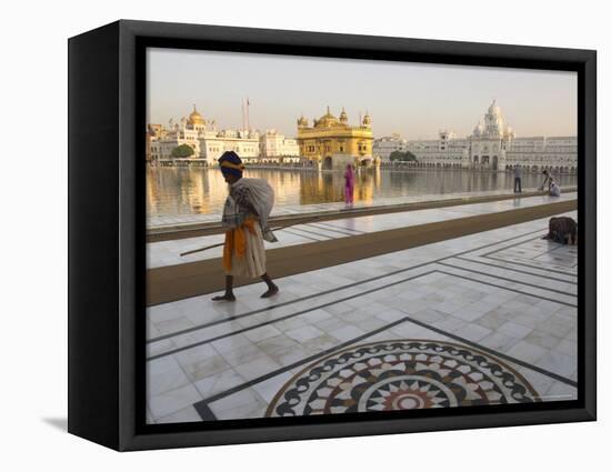 Elderly Sikh Pilgrim with Bundle and Stick Walking Around Holy Pool, Amritsar, India-Eitan Simanor-Framed Premier Image Canvas