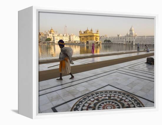 Elderly Sikh Pilgrim with Bundle and Stick Walking Around Holy Pool, Amritsar, India-Eitan Simanor-Framed Premier Image Canvas