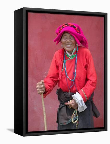 Elderly Tibetan Woman with Red Wall, Tagong, Sichuan, China-Keren Su-Framed Premier Image Canvas