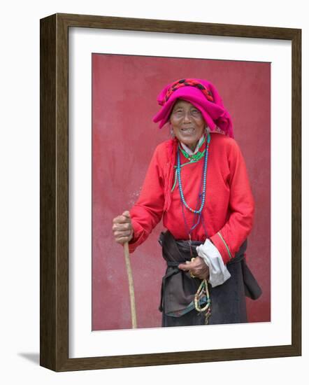 Elderly Tibetan Woman with Red Wall, Tagong, Sichuan, China-Keren Su-Framed Photographic Print