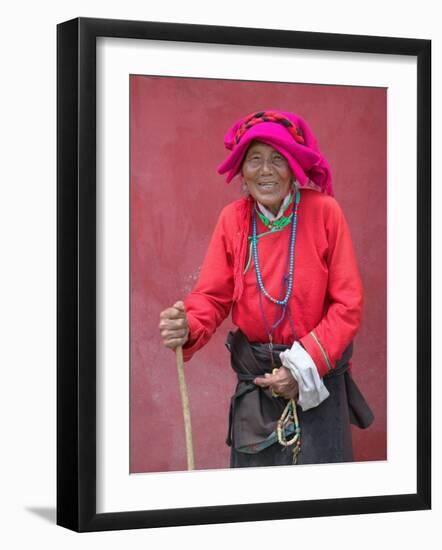 Elderly Tibetan Woman with Red Wall, Tagong, Sichuan, China-Keren Su-Framed Photographic Print