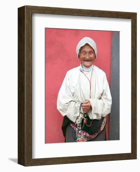 Elderly Tibetan Woman with Red Wall, Tagong, Sichuan, China-Keren Su-Framed Photographic Print