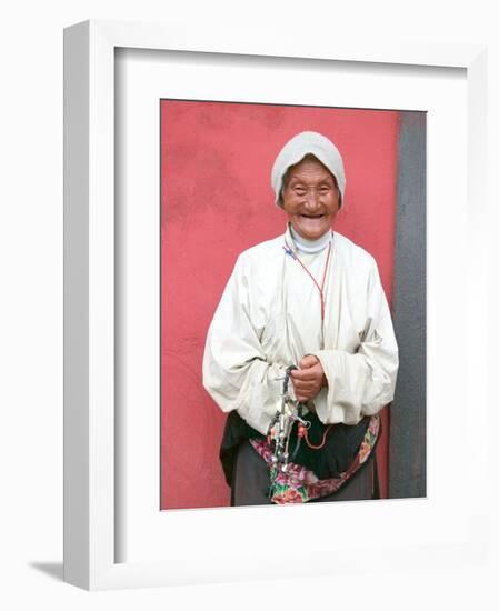 Elderly Tibetan Woman with Red Wall, Tagong, Sichuan, China-Keren Su-Framed Photographic Print