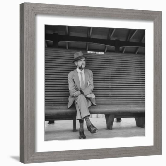 Elderly White South African Smoking Pipe Alone on Bench with Sign Noting, For Europeans Only-Nat Farbman-Framed Photographic Print