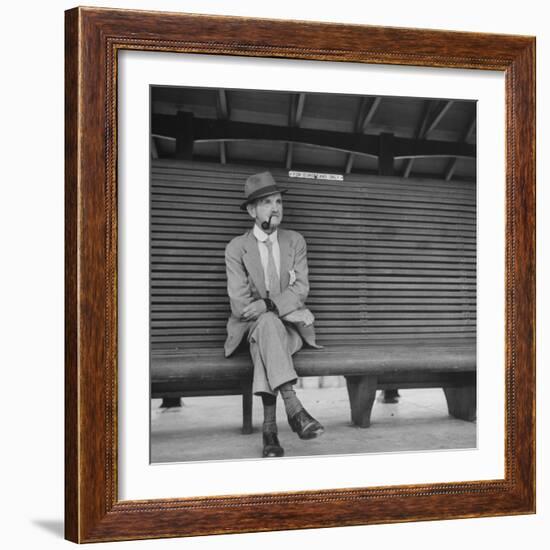 Elderly White South African Smoking Pipe Alone on Bench with Sign Noting, For Europeans Only-Nat Farbman-Framed Photographic Print