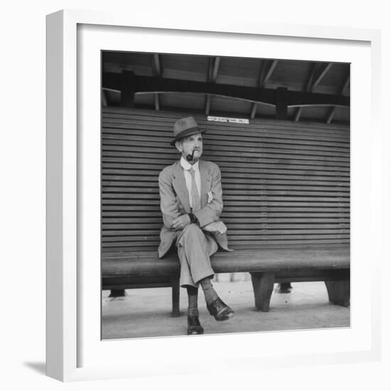 Elderly White South African Smoking Pipe Alone on Bench with Sign Noting, For Europeans Only-Nat Farbman-Framed Photographic Print