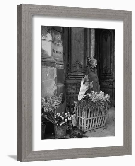 Elderly Woman Selling Flowers Outside Gallerie du Bac, Paris-Gjon Mili-Framed Photographic Print