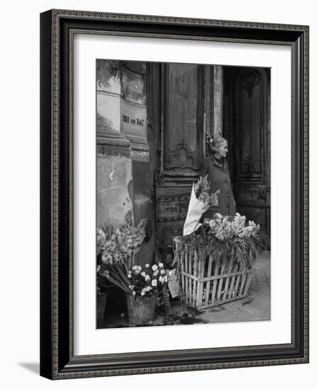 Elderly Woman Selling Flowers Outside Gallerie du Bac, Paris-Gjon Mili-Framed Photographic Print