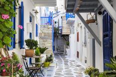 Narrow street, whitewashed buildings with blue paint work, flowers, Mykonos Town (Chora), Mykonos,-Eleanor Scriven-Photographic Print