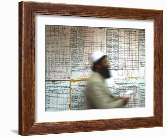 Electoral Worker Passes Election Results Posted on Wall at a Counting Center in Kabul, Afghanistan-null-Framed Photographic Print