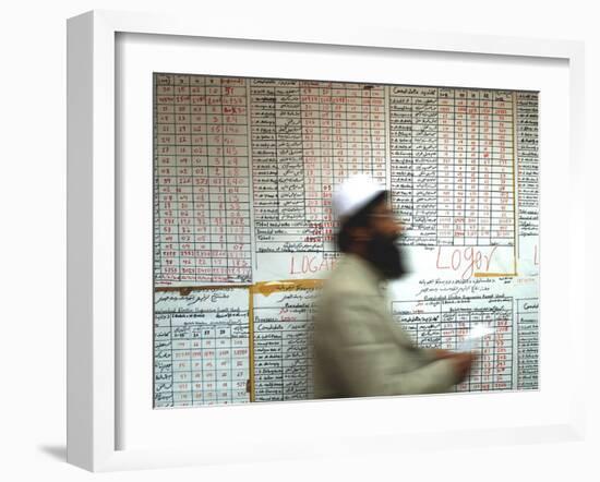 Electoral Worker Passes Election Results Posted on Wall at a Counting Center in Kabul, Afghanistan-null-Framed Photographic Print