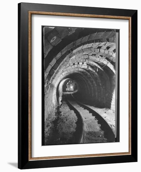 Electric Locomotive on Track in Powderly Anthracite Coal Mine Gangway, Owned by Hudson Coal Co-Margaret Bourke-White-Framed Photographic Print