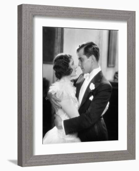 Elegant Couple Holding and Looking at Each Other-null-Framed Photo