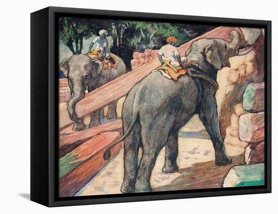 Elephants Handling Logs-John Edwin Noble-Framed Premier Image Canvas