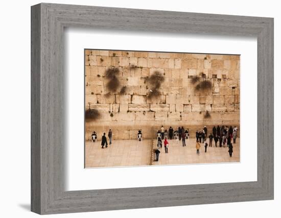 Elevated view of the Western Wall Plaza with people praying at the wailing wall, Jewish Quarter...-null-Framed Photographic Print