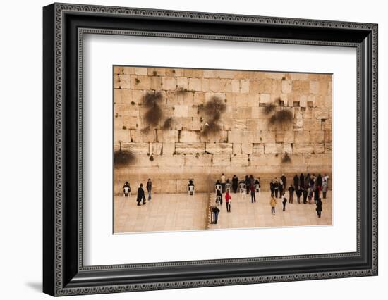 Elevated view of the Western Wall Plaza with people praying at the wailing wall, Jewish Quarter...-null-Framed Photographic Print