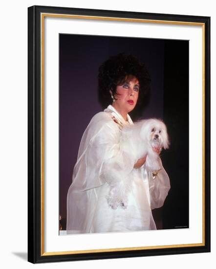 Elizabeth Taylor Holding Dog-null-Framed Premium Photographic Print